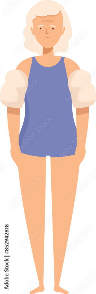 Senior woman wearing inflatable armbands standing ready for a swimming lesson Senior woman wearing inflatable armbands standing ready for a swimming lesson