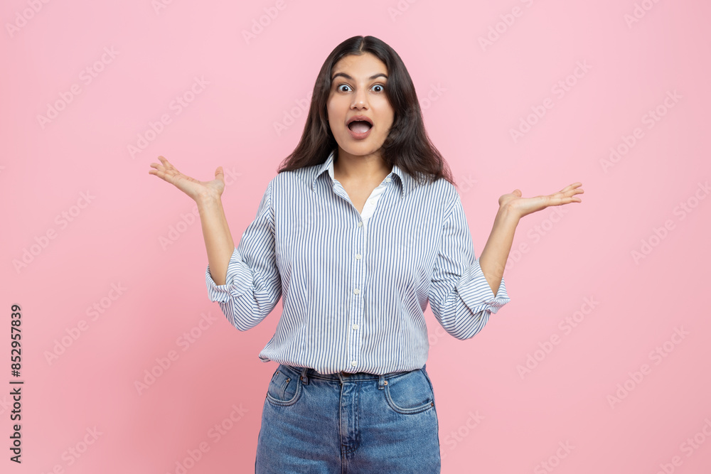 Shocked Indian woman spreading hands Shocked Indian woman spreading hands