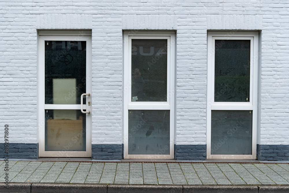 Fototapeta premium white house wall with even windows