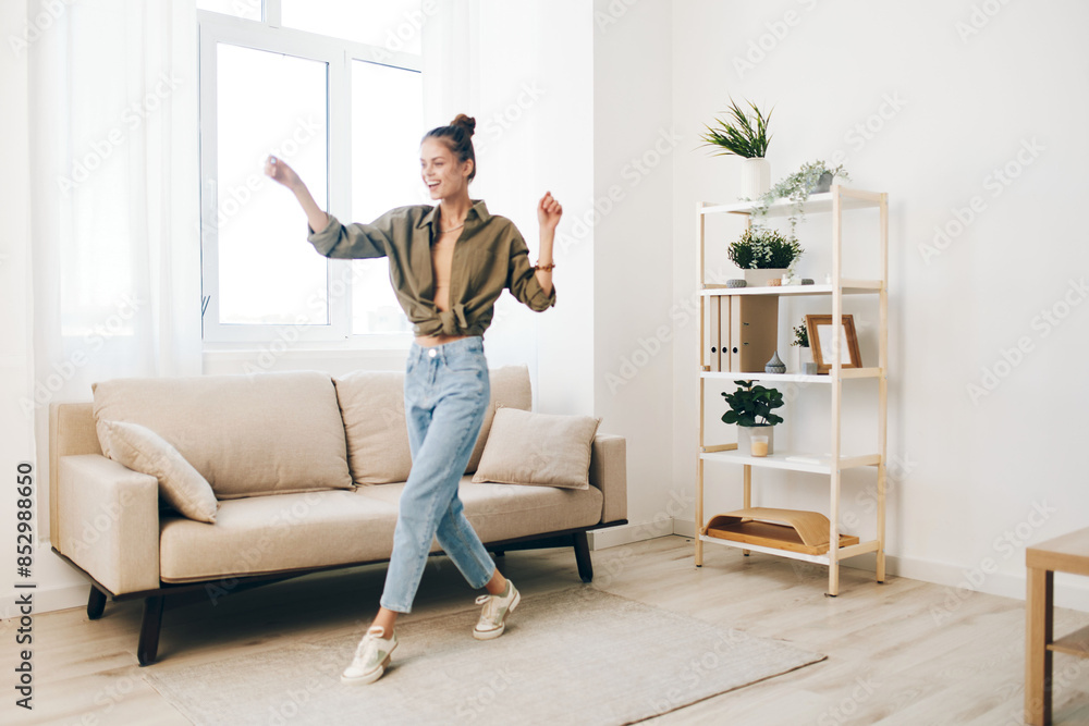 Joyful Woman Dancing with Excitement in a Playful Home Interior Joyful Woman Dancing with Excitement in a Playful Home Interior