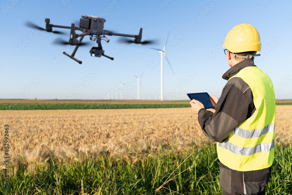 Engineer controls drone for wind turbines inspection Engineer controls drone for wind turbines inspection
