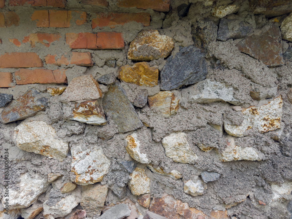 Fragment of old stone and brick wall in overcast day Fragment of old stone and brick wall in overcast day