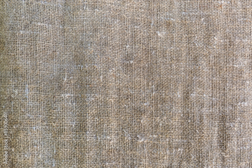 Coarse old sackcloth woven from natural unpainted fibers, background