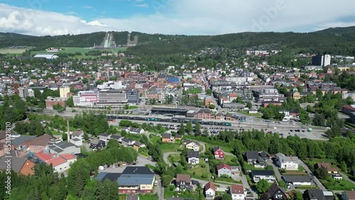 Overflight over the center of Lillehammer with the station in the foreground and Lysgårdsbakkene in the background