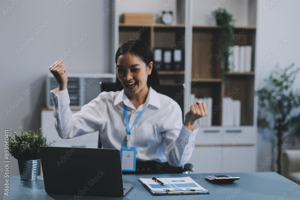Excited happy Asian woman looking at the phone screen, celebrating an online win, overjoyed young asian female screaming with joy, isolated over a white blur background Excited happy Asian woman looking at the phone screen, celebrating an online win, overjoyed young asian female screaming with joy, isolated over a white blur background