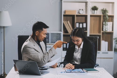 Wallpaper Mural Manager is hard talking with employee in an office. Businessmen arguing at workplace, disagreeing over document, partners having conflict while negotiating, business deal failure Torontodigital.ca