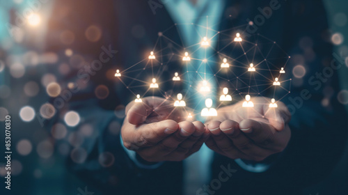 Businessman holding virtual Human Resources network connection icons. Employee Engagement, Talent Management, Workforce Connectivity. Internet business and social network