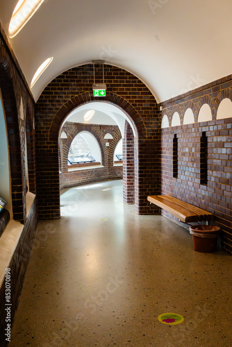 Corridors through a building with round arches on bricks