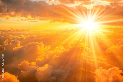 A golden sunset cloud under the sun shines on earth, with rays of light shining through clouds and illuminating them