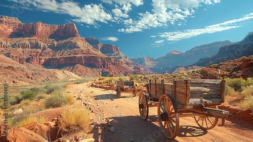 Old Wooden Wagons in Majestic Red Rock Desert Landscape Under Blue Sky photo