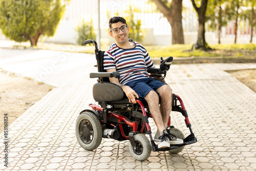 Принти на полотні A 40-year-old disabled adult male is sitting in an automatic wheelchair