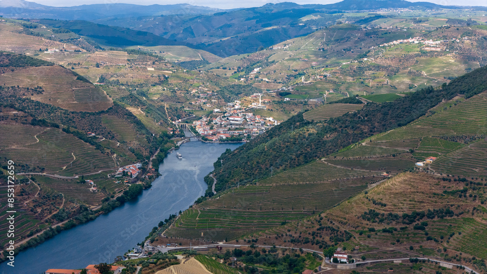 Fototapeta premium View of the terraced vineyards in the Douro Valley and river near the village of Pinhao, Portugal. Concept for travel in Portugal and most beautiful places in Portugal
