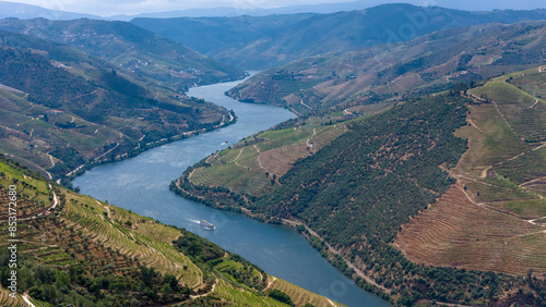 View of the terraced vineyards in the Douro Valley and river near the village of Pinhao, Portugal. Concept for travel in Portugal and most beautiful places in Portugal photo