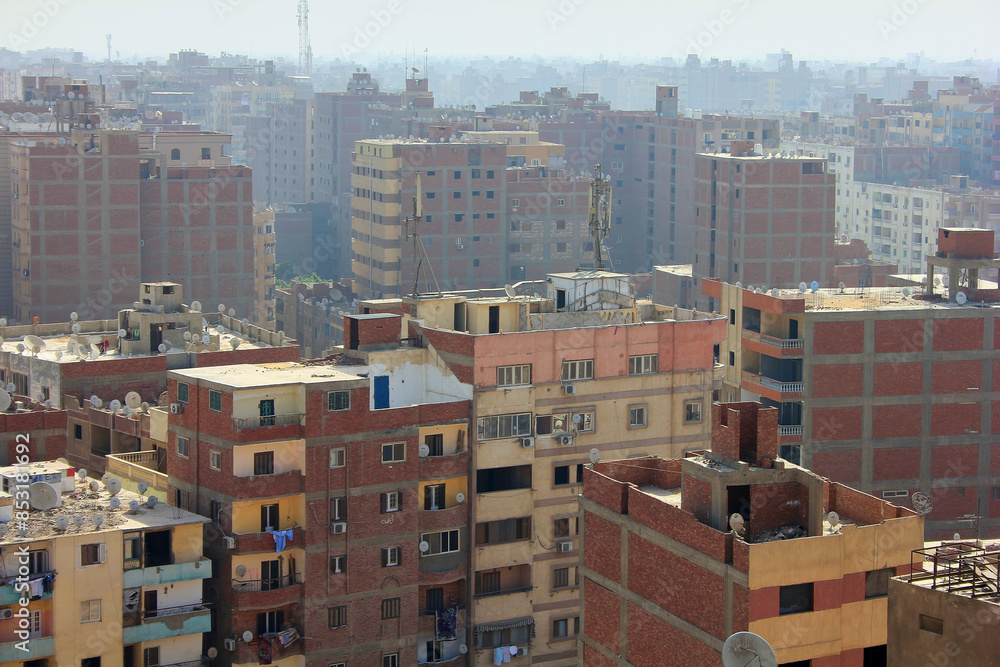 A bird's eye view of the buildings of Egypt. Cityscape. Slums with satellite dishes on rooftops. A bird's eye view of the buildings of Egypt. Cityscape. Slums with satellite dishes on rooftops.