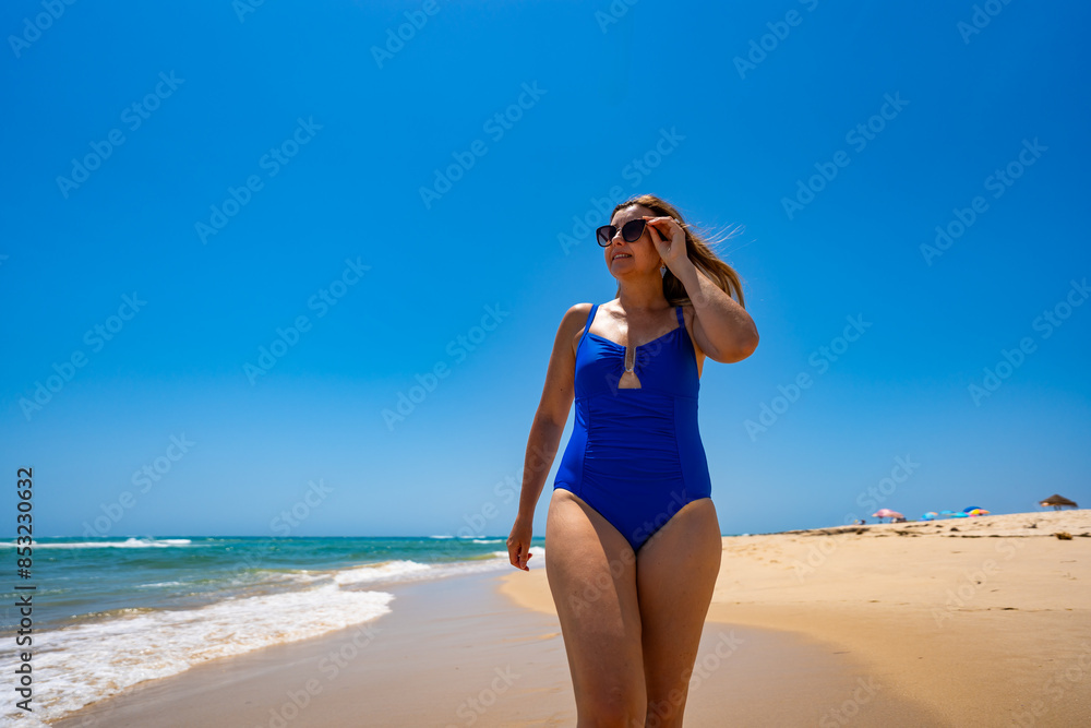 Beautiful woman walking on sunny beach Portugal, Algarve, praia Armona
Beautiful woman walking on sunny beach Portugal, Algarve, praia Armona