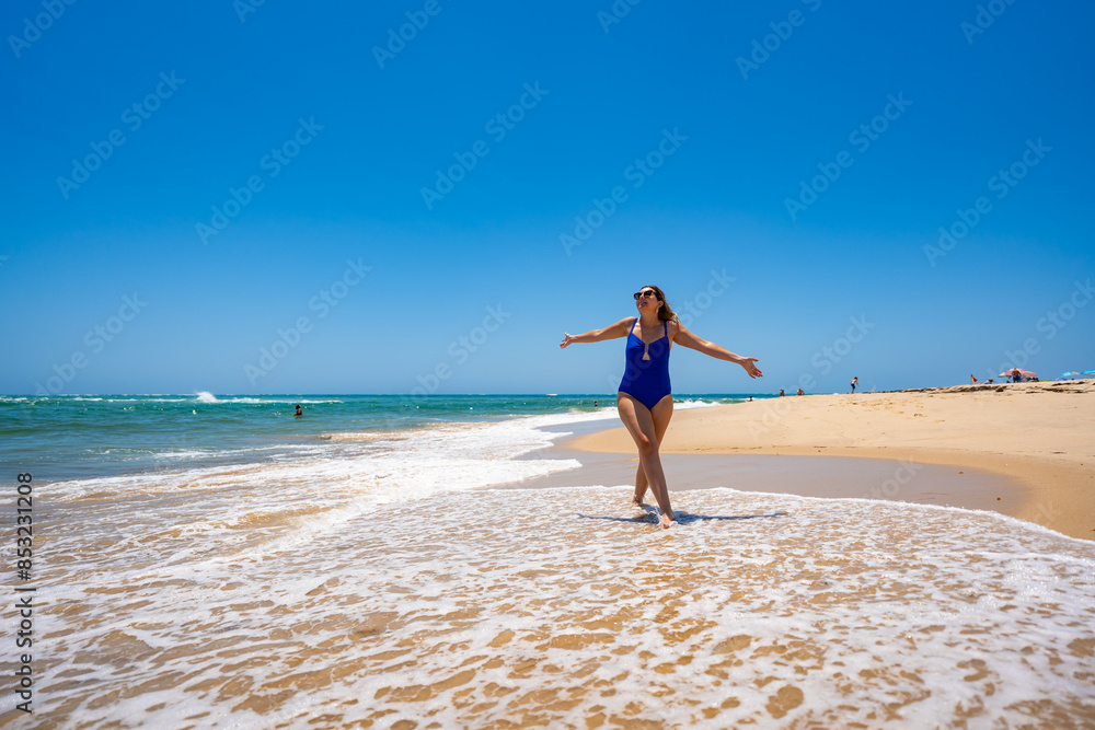 Beautiful woman walking on sunny beach Portugal, Algarve, praia Armona
Beautiful woman walking on sunny beach Portugal, Algarve, praia Armona