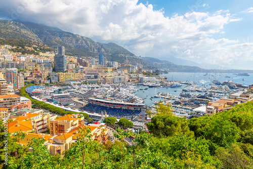 Bild auf Leinwand Panoramic view from the Rock of Monaco of the city of Monte Carlo, Monaco, the harbor port, mountains and city with the streets converted to race course on Grand Prix day