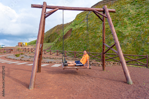 Viewpoint and recreational area with swing at the top of Faja de Joao Dias. São Jorge Island-Azores-Portugal. photo