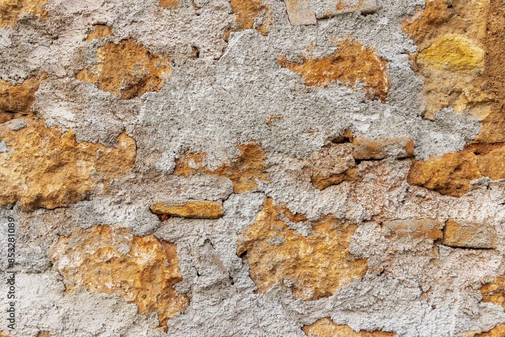 Naklejka premium Old stone and cement in wall. Crete.