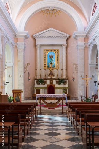 November 05, 2023. Europe, Greece, Crete, Chania, Old Town. Cathedral of the Assumption of the Virgin Mary. Roman Catholic Church. Interior. Nave with pews looking toward altar. Editorial use only.