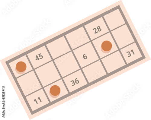 Bingo card lying on a surface showing random numbers with red markers