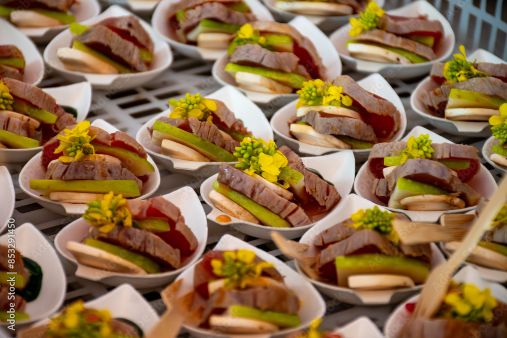 Fototapeta premium Degustation appetisers for visitors made by great chefs of haute cuisine French restaurants, wine festival in Tours, Loire valley, France