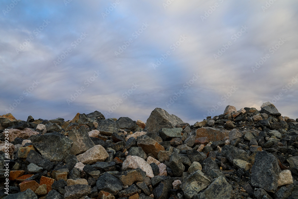 Obraz premium Mining industry waste rock dump with sky. Background concept. Copy space. Template for presentation.