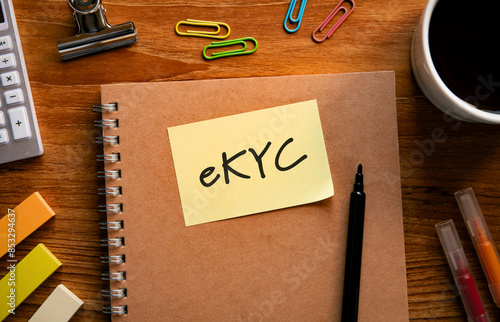 There is sticky note with the word eKYC. It is an abbreviation for electronic Know Your Customer as eye-catching image. photo