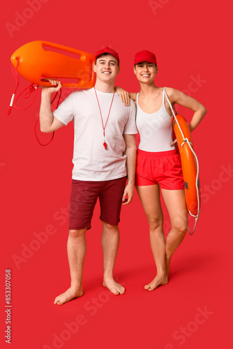 Lifeguards with ring buoy a...