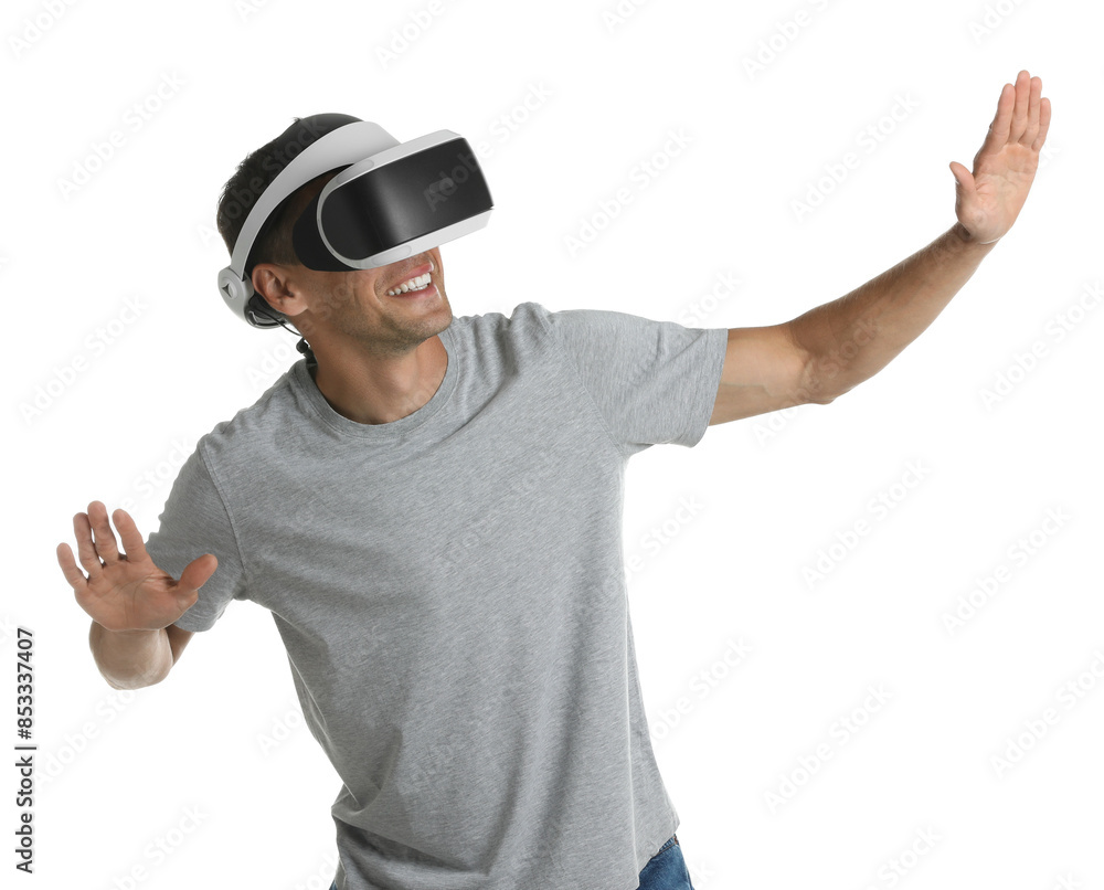 Smiling man using virtual reality headset on white background Smiling man using virtual reality headset on white background