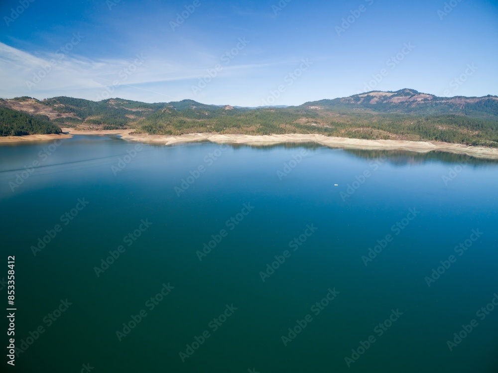Reservoir lake reduced in volume due to drought conditions. Lost Creek Lake, Oregon, United States of America. Reservoir lake reduced in volume due to drought conditions. Lost Creek Lake, Oregon, United States of America.