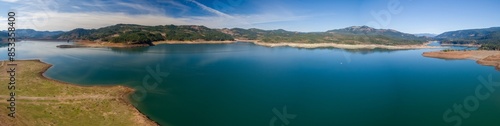 Reservoir lake reduced in volume due to drought conditions. Lost Creek Lake, Oregon, United States of America.