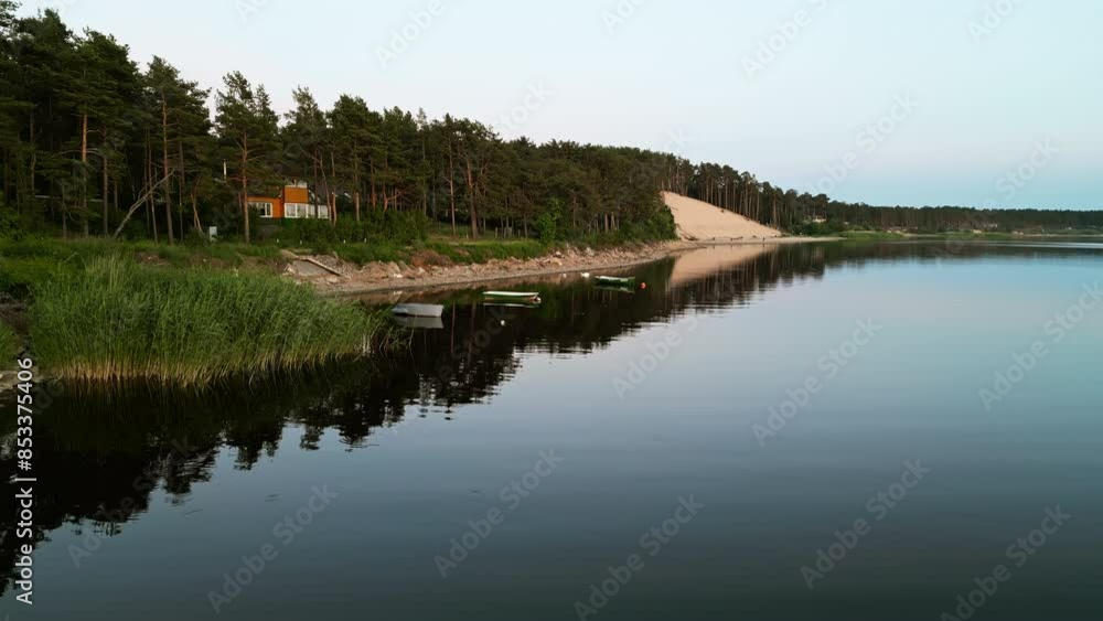 A serene aerial view of a tranquil lake and dock surrounded by greenery, offering a peaceful landscape A serene aerial view of a tranquil lake and dock surrounded by greenery, offering a peaceful landscape
