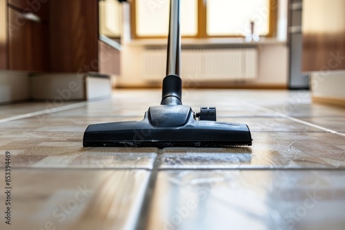 Vacuum Cleaning Floor in Kitchen