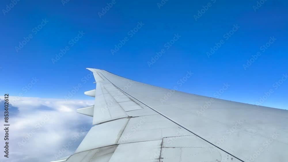 The plane is flying You can see airplane wings and beautiful nature. The plane is flying You can see airplane wings and beautiful nature.