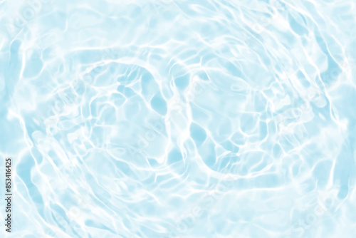 Blue water with ripples on the surface. Defocus blurred transparent blue colored clear calm water surface texture with splashes and bubbles. Water waves with shining pattern texture background.