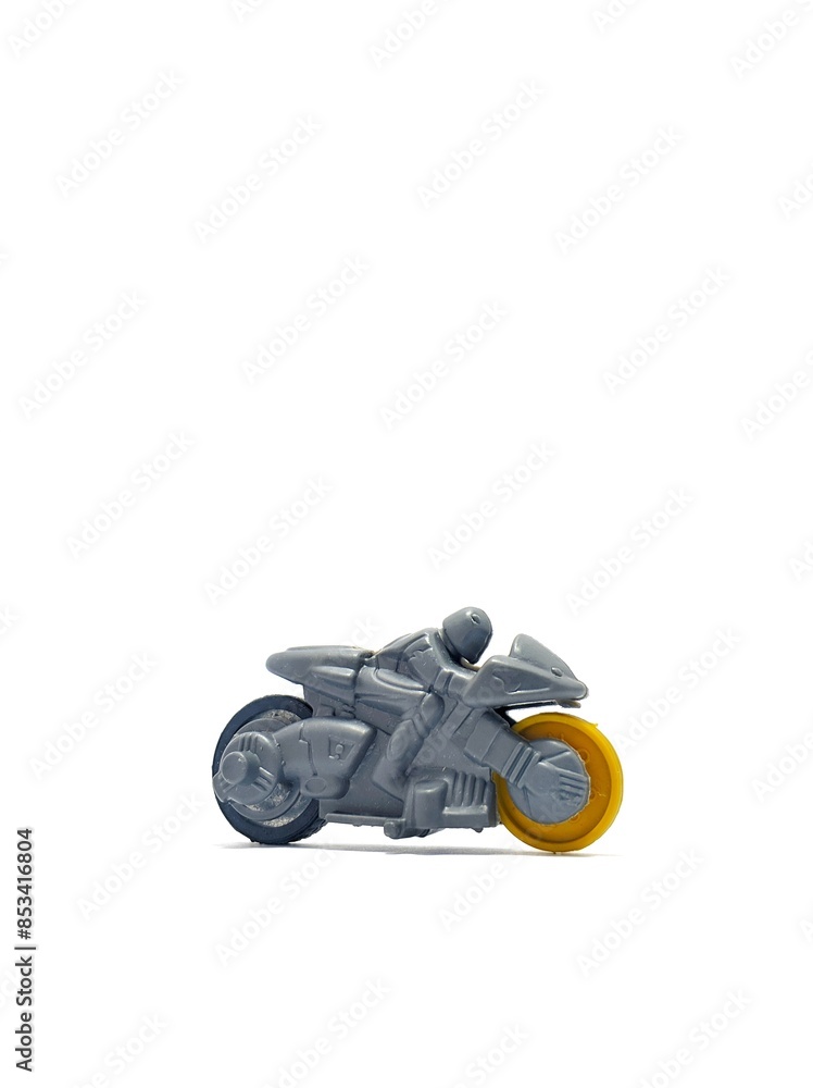Motorcycle toy made from plastic with futuristic sporty rider design isolated on white background Motorcycle toy made from plastic with futuristic sporty rider design isolated on white background