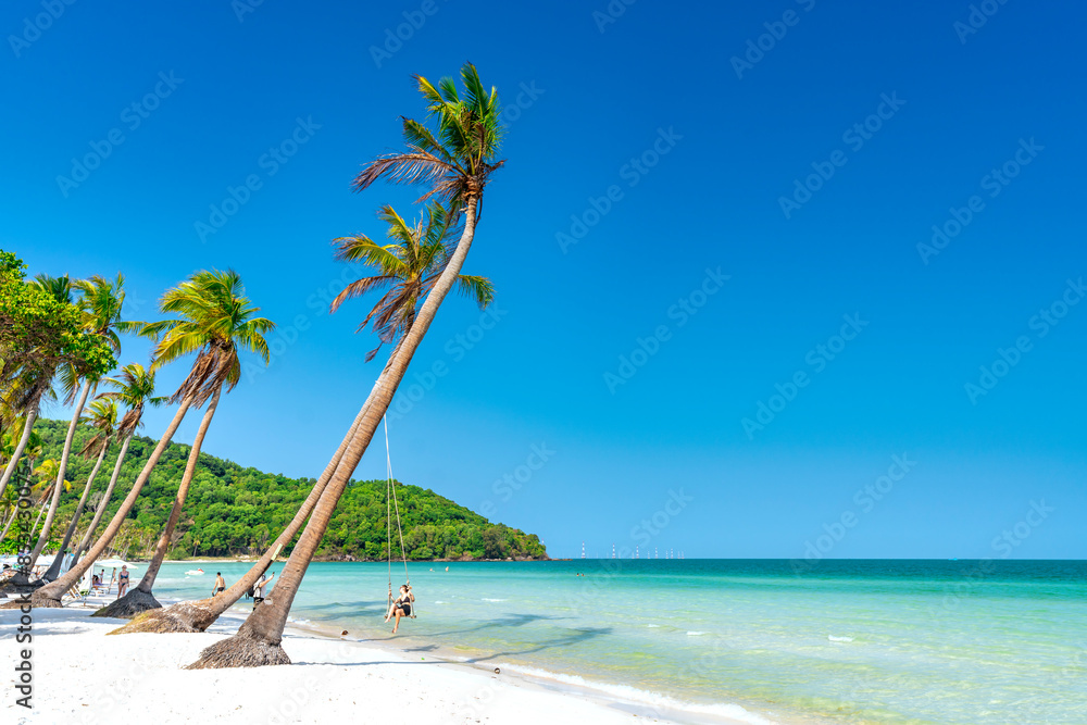 Seascape with tropical palms on beautiful Sao sandy beach in Phu Quoc island, Vietnam
