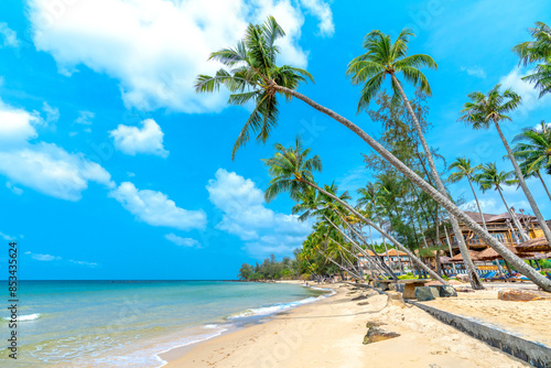 Nice beach in Phu Quoc island Vietnam. The bay with blue water, coconut trees, and fine sand is considered a beautiful beach in the Gulf of Thailand photo