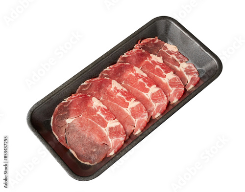 Thinly sliced ​​fresh Ribeye (Beef) arranged on a black tray isolated on white background.