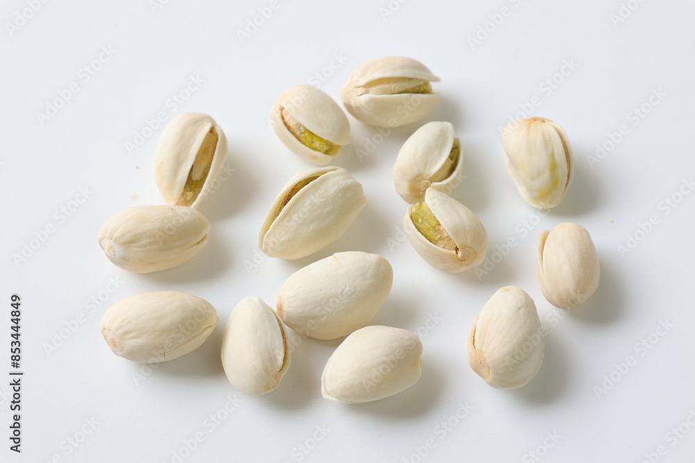 pistachio nuts on white background pistachio nuts on white background