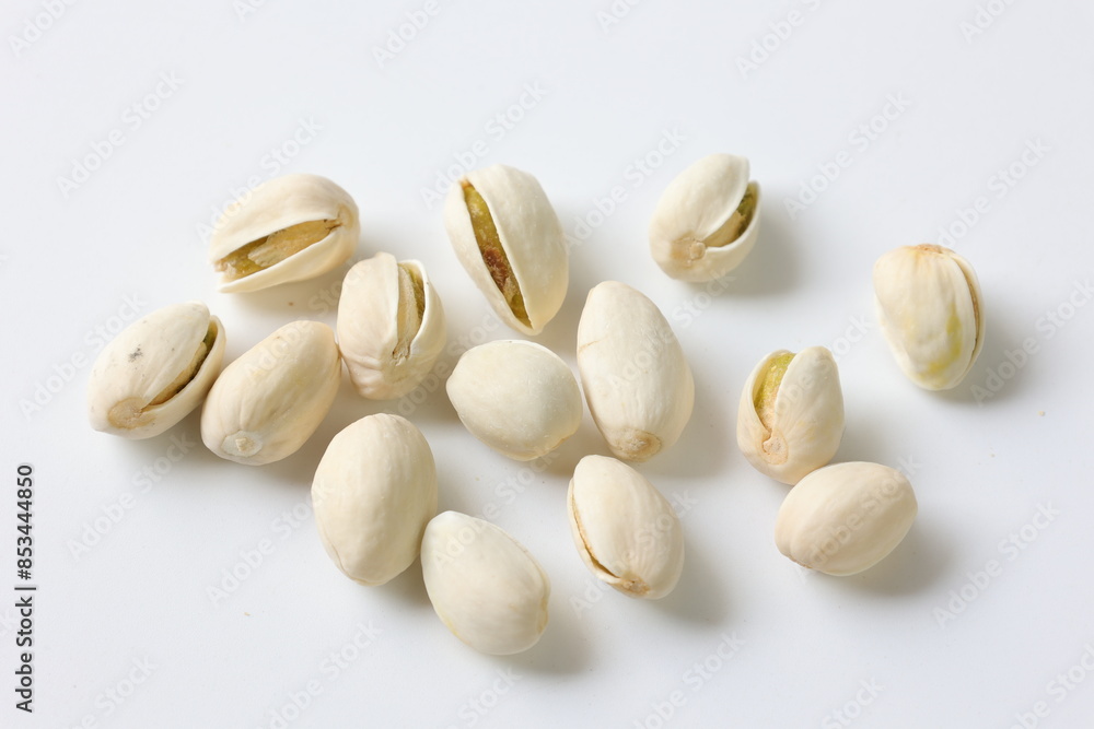 pistachio nuts on white background pistachio nuts on white background