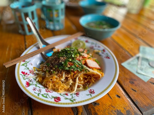 Photography Plate of Pad Thai on a Wooden Table