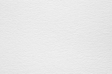 A close-up shot of a white watercolor paper texture with a subtle embossed pattern.