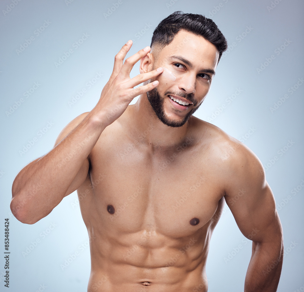 Fototapeta premium Skincare, portrait and happy man in studio with cream for cosmetics, natural glow or treatment on white background. Body, hands and model with lotion for satisfaction, dermatology or moisturizer