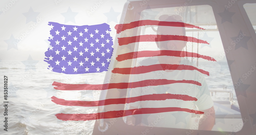 Fototapeta premium American flag design pattern against caucasian man sitting in a boat