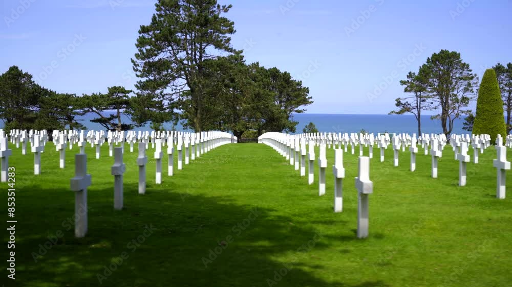 A tracking shot of rows of white crosses marking the graves of fallen American allied soldiers who died during the Normandy invasion at Omaha Beach on D-Day, 1944. A tracking shot of rows of white crosses marking the graves of fallen American allied soldiers who died during the Normandy invasion at Omaha Beach on D-Day, 1944.
