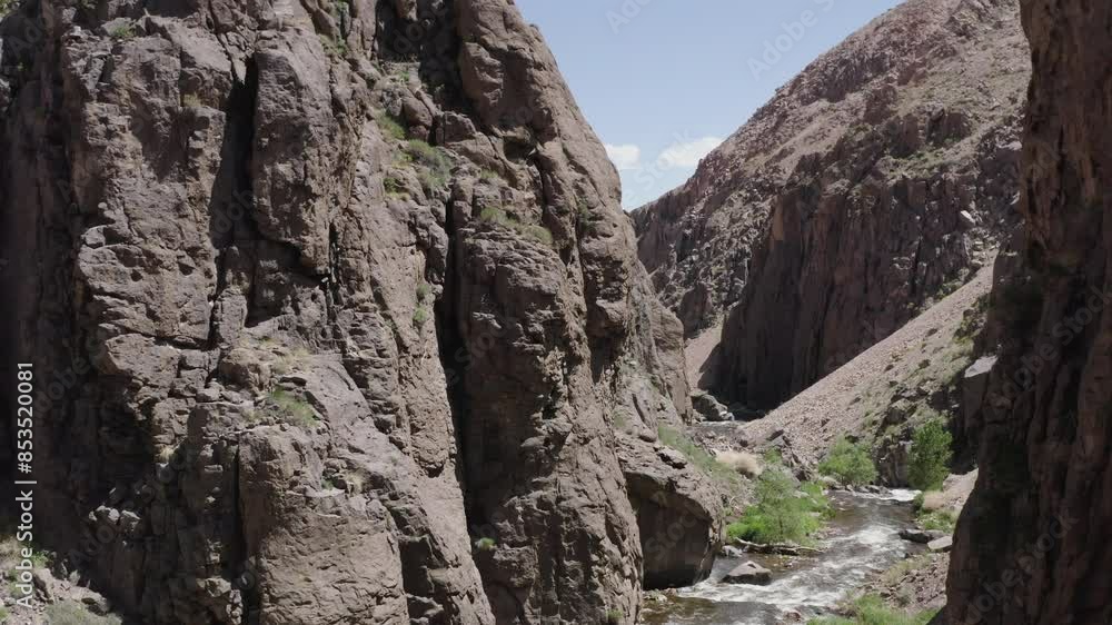 River flowing through Canyons of Alabama Hills, Sierra Nevada, California. Aerial revealing shot River flowing through Canyons of Alabama Hills, Sierra Nevada, California. Aerial revealing shot