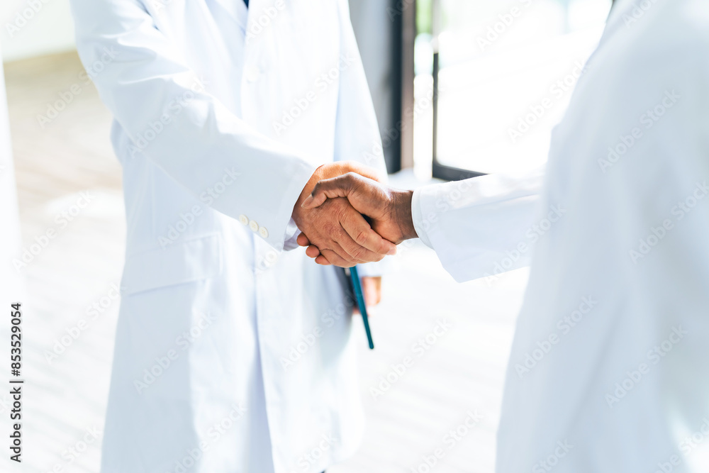 A group of multinational researchers or doctors shaking hands in the lobby A group of multinational researchers or doctors shaking hands in the lobby