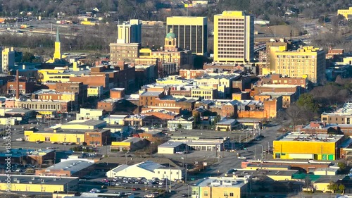 A beautiful late afternoon 4k aerial video of Downtown Macon, moving from Cherry to Mulberry Street. This clip showcases the city's vibrant activity and blend of historical and modern architecture. photo